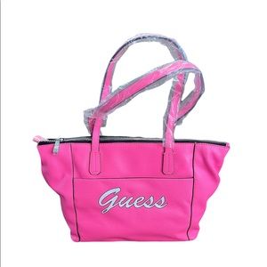 Guess neon pink skools out large purse.       T2